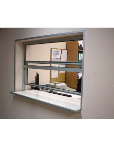 Vertically sliding infeed/cashier window