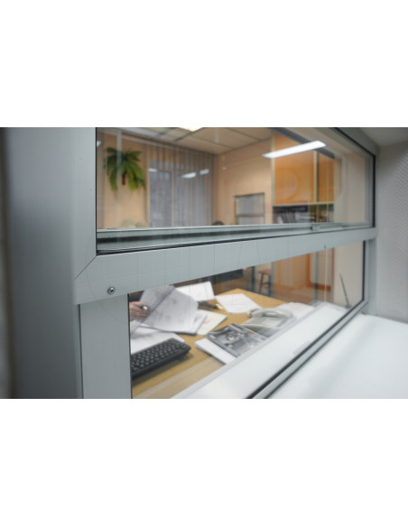 Vertically sliding infeed/cashier window